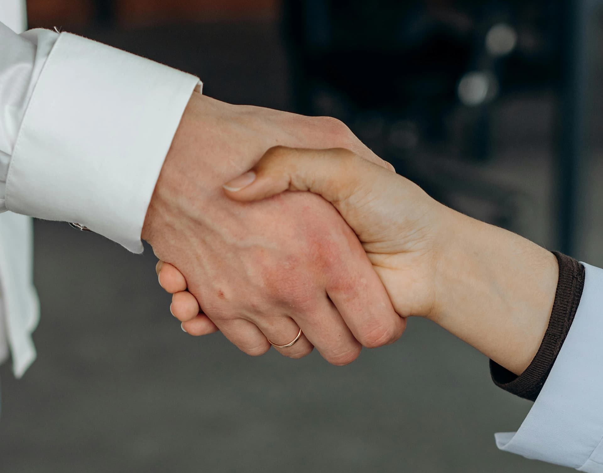 Close-up of a firm professional handshake