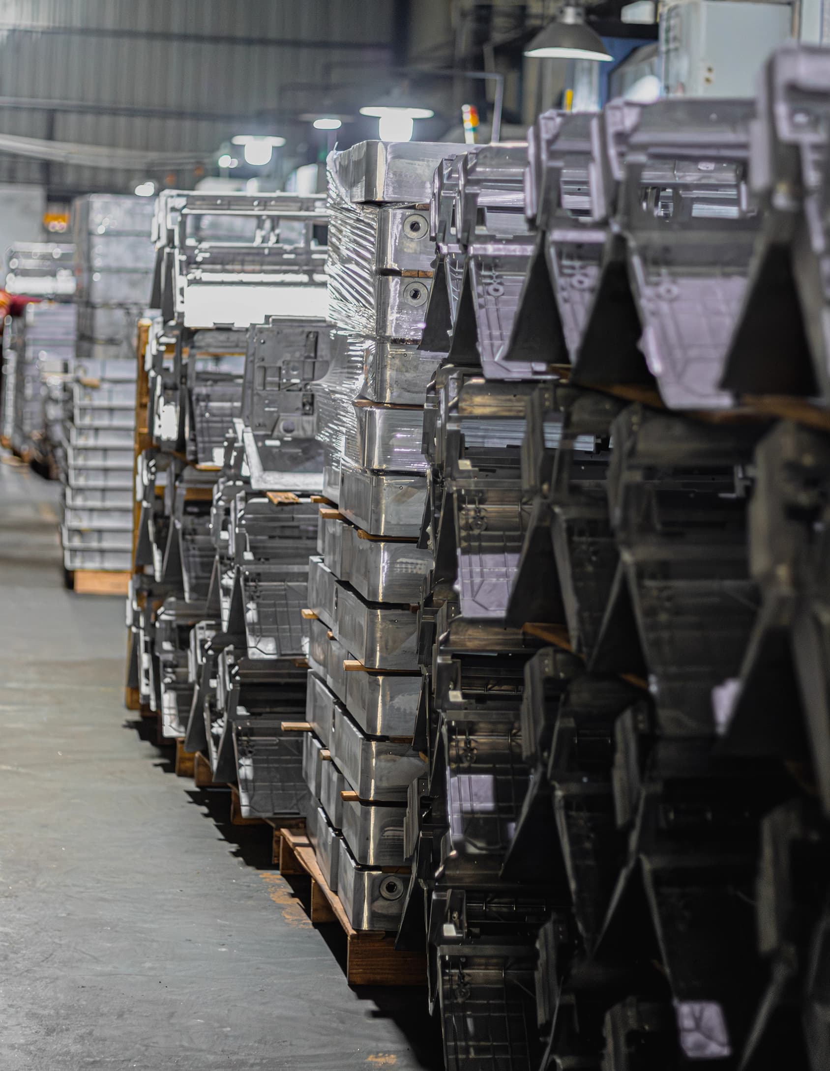 Rows of palletized parts stacked in warehouse distribution center